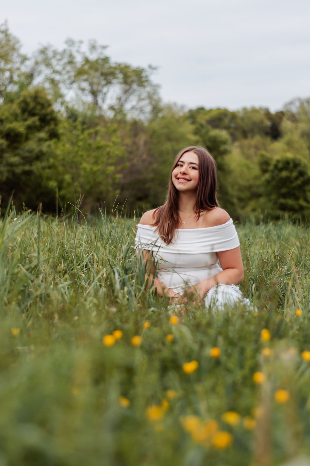 Senior portrait in a wildflower field in Upper St. Clair near Pittsburgh