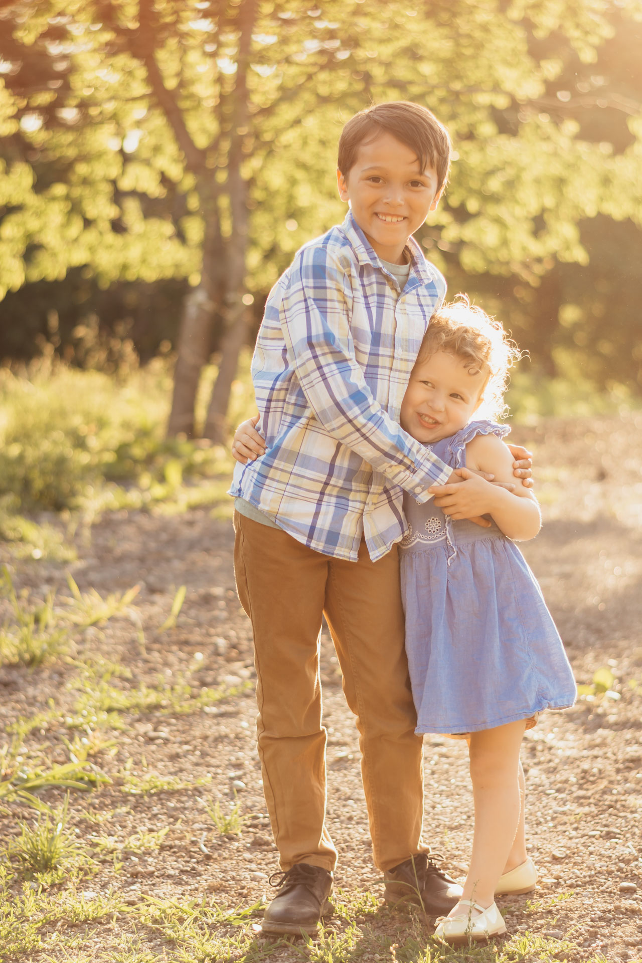Siblings hugging during a family photo session in the South Hills